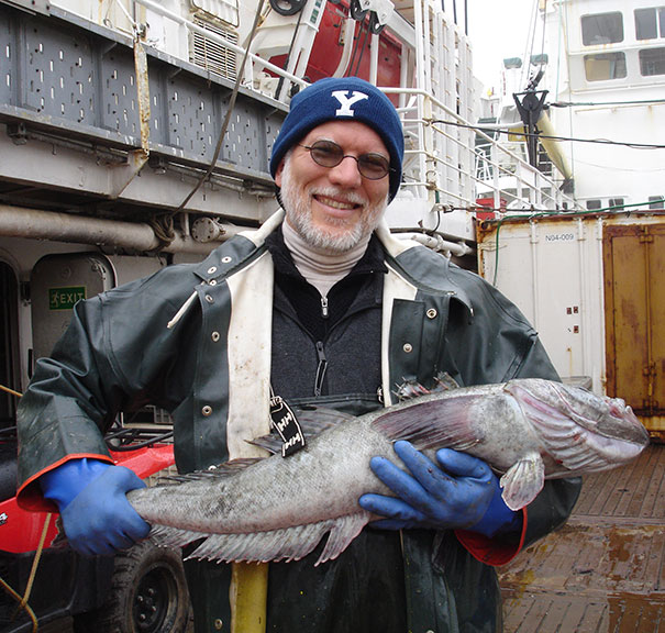 Jon Moore holding a toothfish on <em>Yuzumo</em> Antarctic cruise